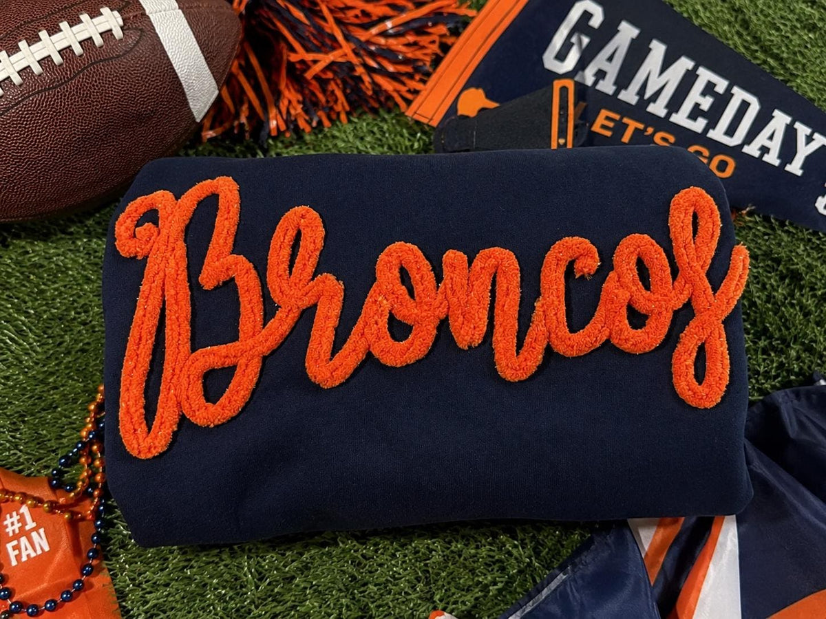 Navy sweatshirt with custom orange chenille script team name